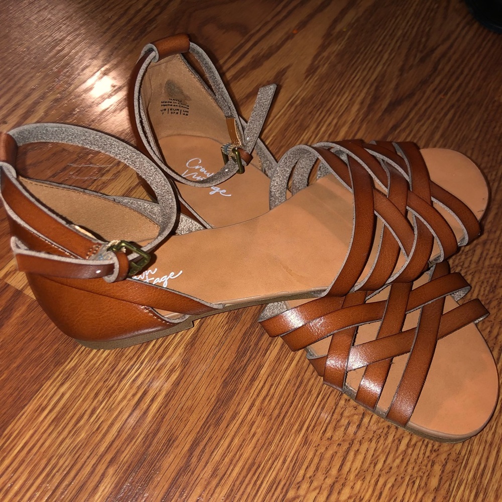 brown weaved sandals with ankle strap